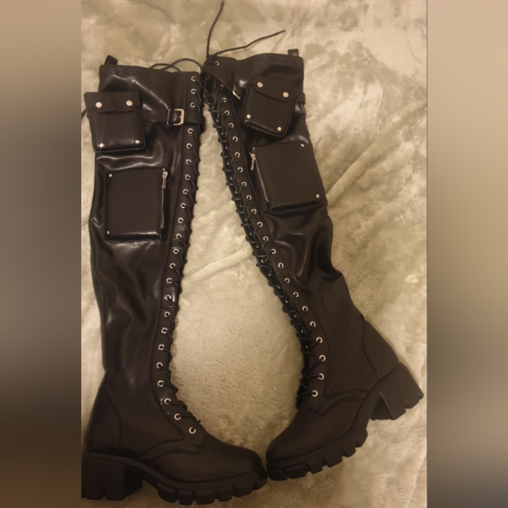 Knee high boots with pockets on side